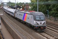 acs-64 in NJ Transit disco stripe